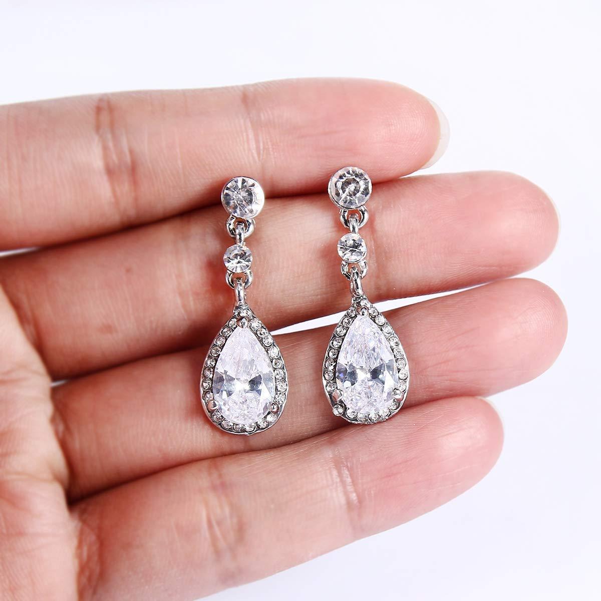 Elegant 1.00 Ct Pear Cut Teardrop Earrings in 18K white gold plating, embellished with sparkling Austrian crystals.