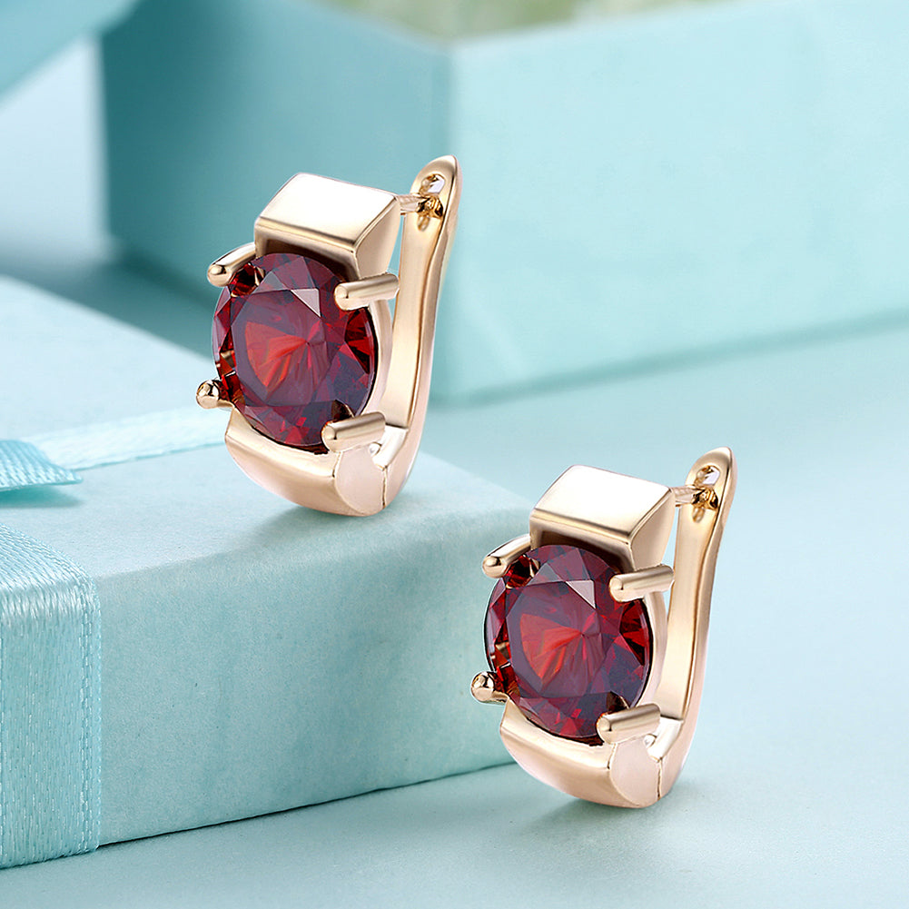 Elegant 1.00 Ct Ruby Round Cut Huggie Earring in 18K Gold Plated, showcasing its vibrant ruby and luxurious gold finish.