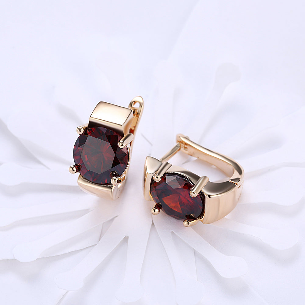 Elegant 1.00 Ct Ruby Round Cut Huggie Earring in 18K Gold Plated, showcasing its vibrant ruby and luxurious gold finish.