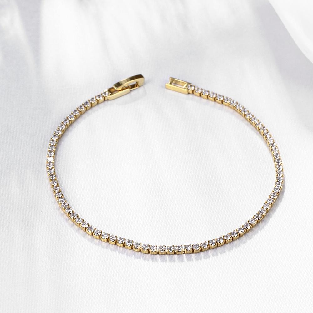 Elegant 10.00 CT White Topaz Gemstone Tennis Bracelet in 18K gold plating, showcasing classic round design and sparkling gemstones.