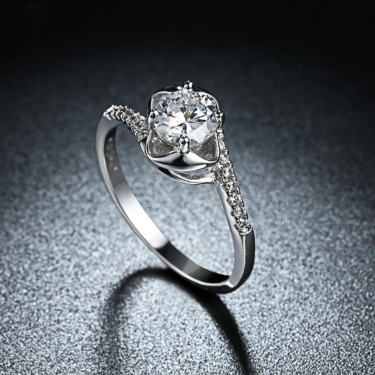 Elegant 1.00 CTTW Engagement Cut Floral White Crystal Pav'e Ring in white gold, featuring sparkling crystals in a floral design.