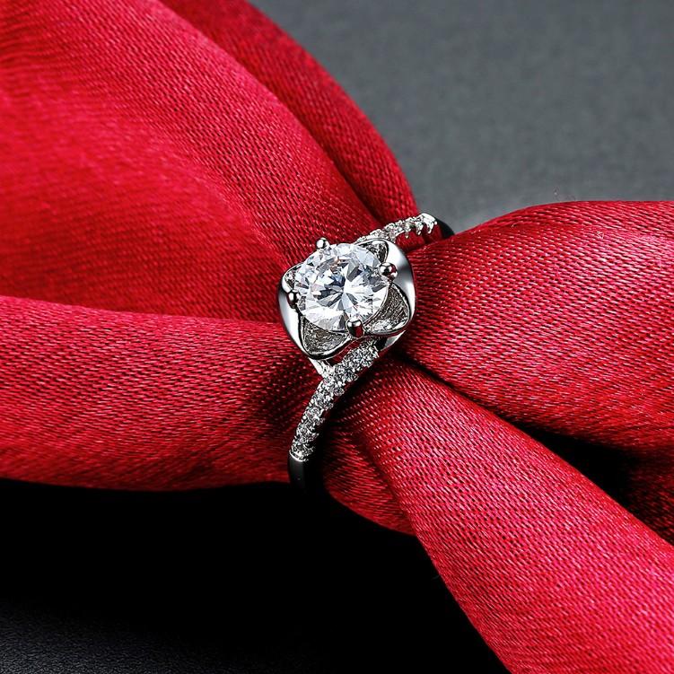 Elegant 1.00 CTTW Engagement Cut Floral White Crystal Pav'e Ring in white gold, featuring sparkling crystals in a floral design.