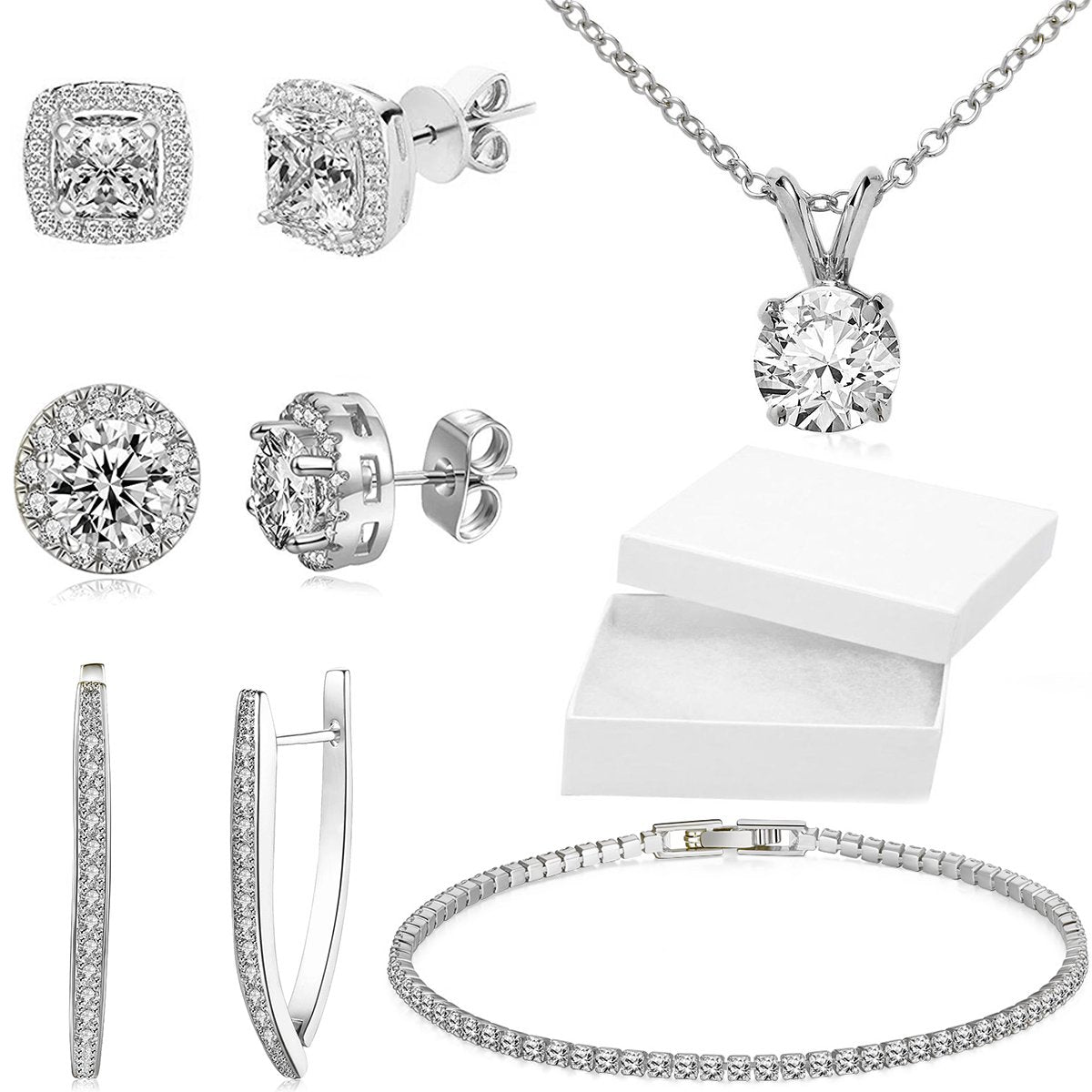 A luxurious 5-piece jewelry set featuring a tennis bracelet, halo earrings, and a necklace, all adorned with sparkling Austrian crystals and 18K white gold plating.