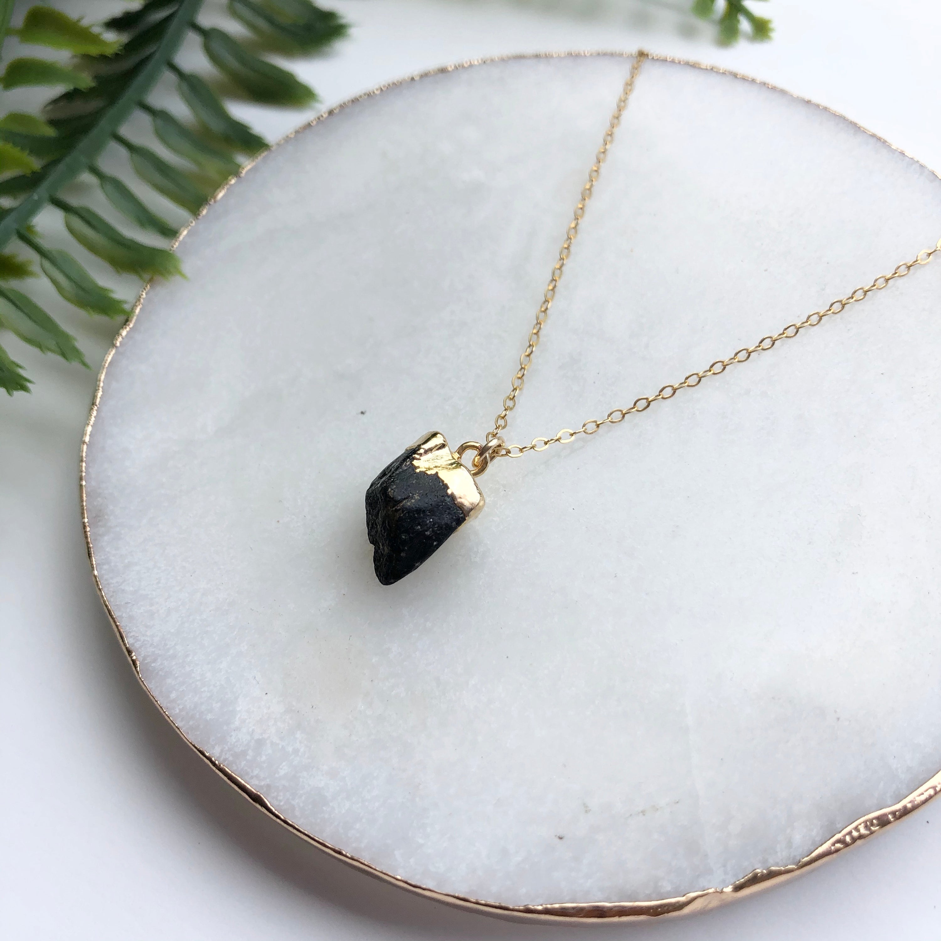 A beautiful 14K gold filled rough nugget necklace showcasing unique, natural nuggets on a delicate chain.