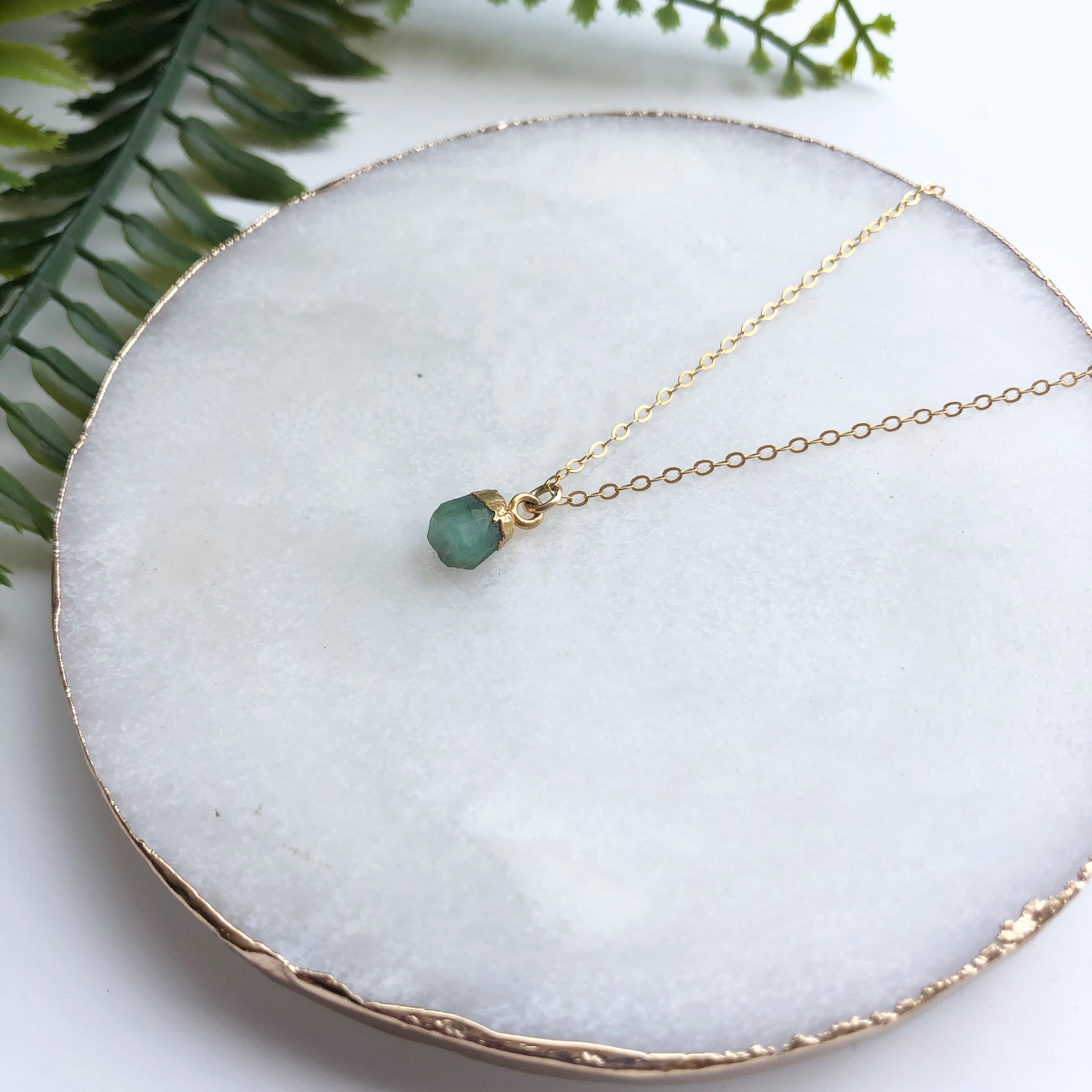 A beautiful 14K gold filled rough nugget necklace showcasing unique, natural nuggets on a delicate chain.