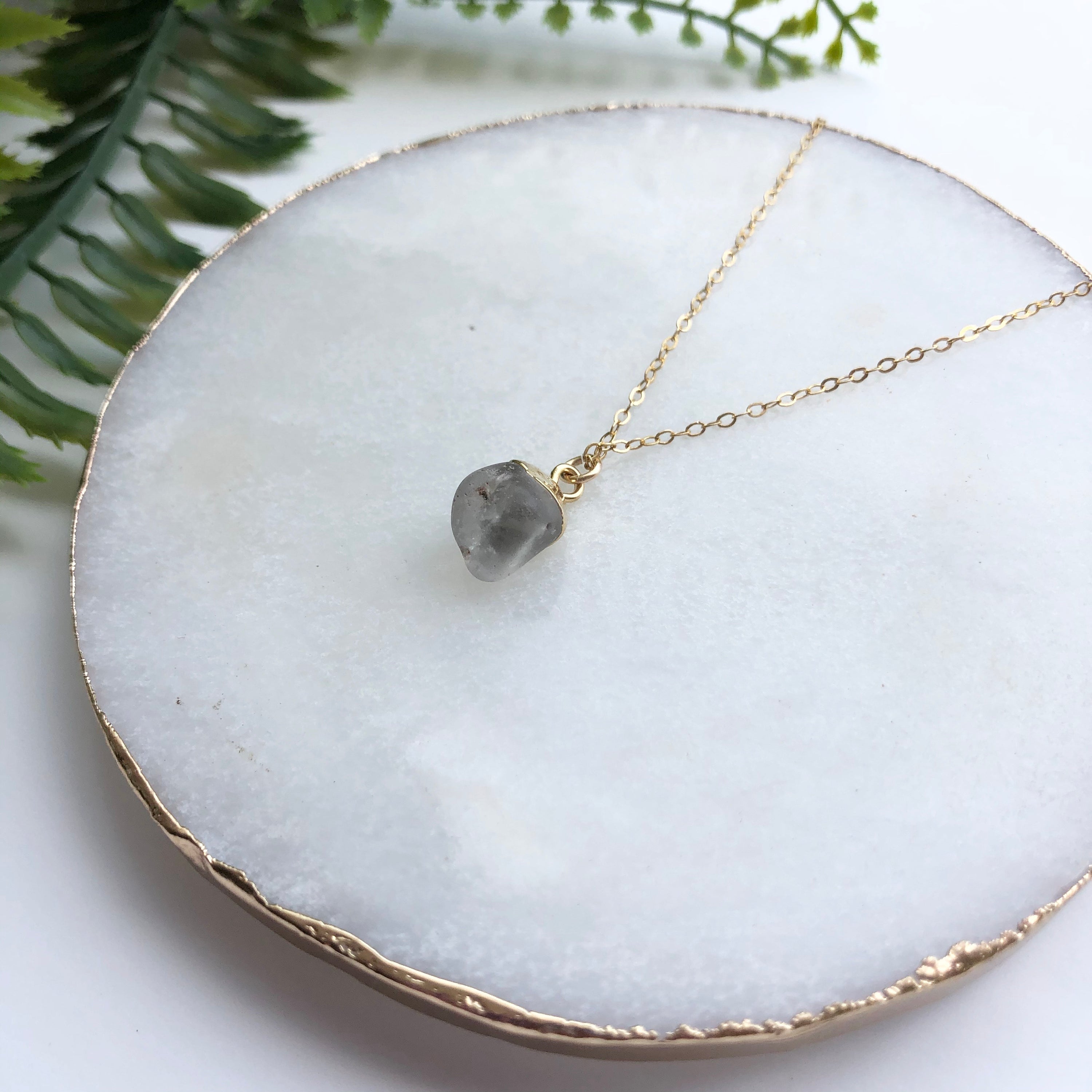 A beautiful 14K gold filled rough nugget necklace showcasing unique, natural nuggets on a delicate chain.