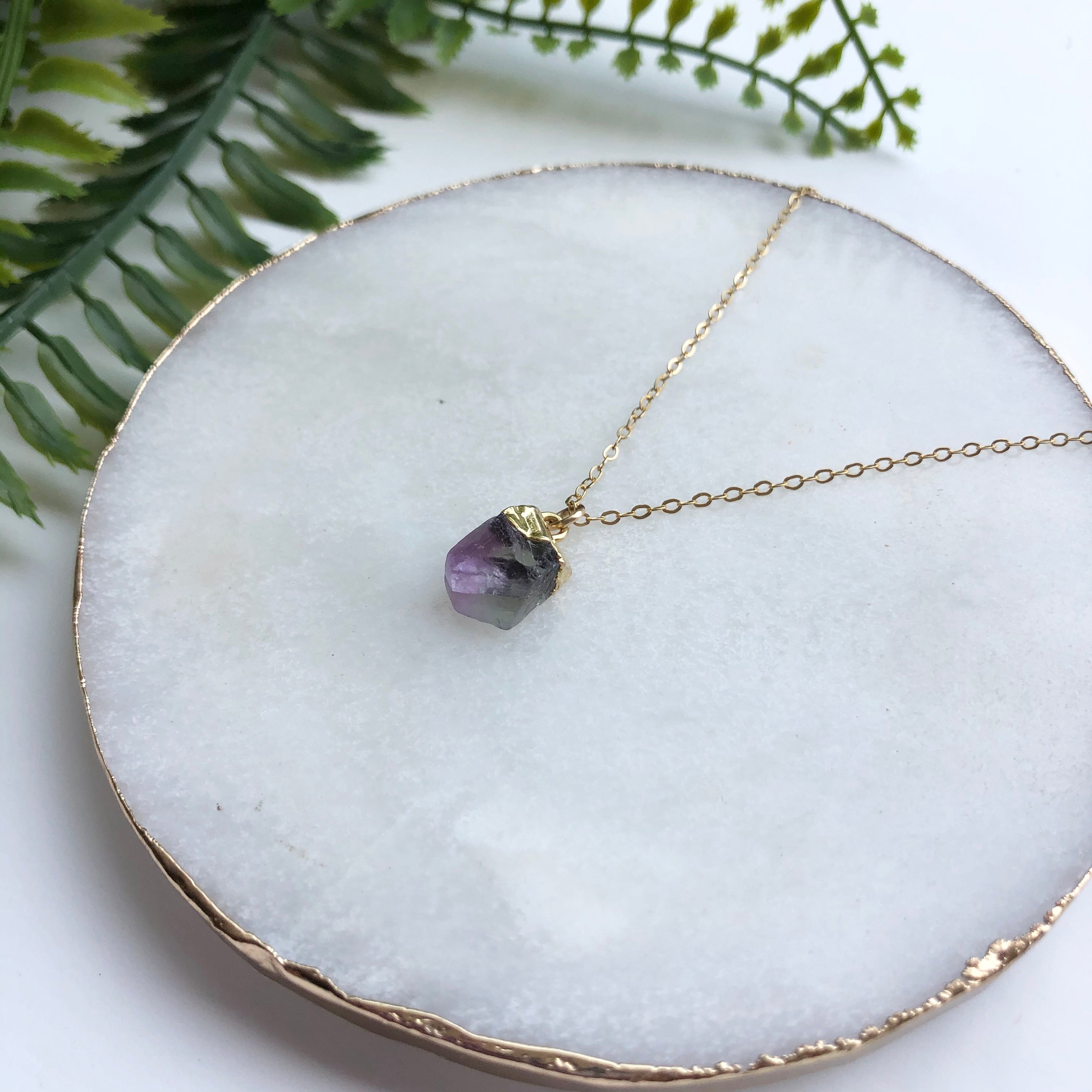 A beautiful 14K gold filled rough nugget necklace showcasing unique, natural nuggets on a delicate chain.