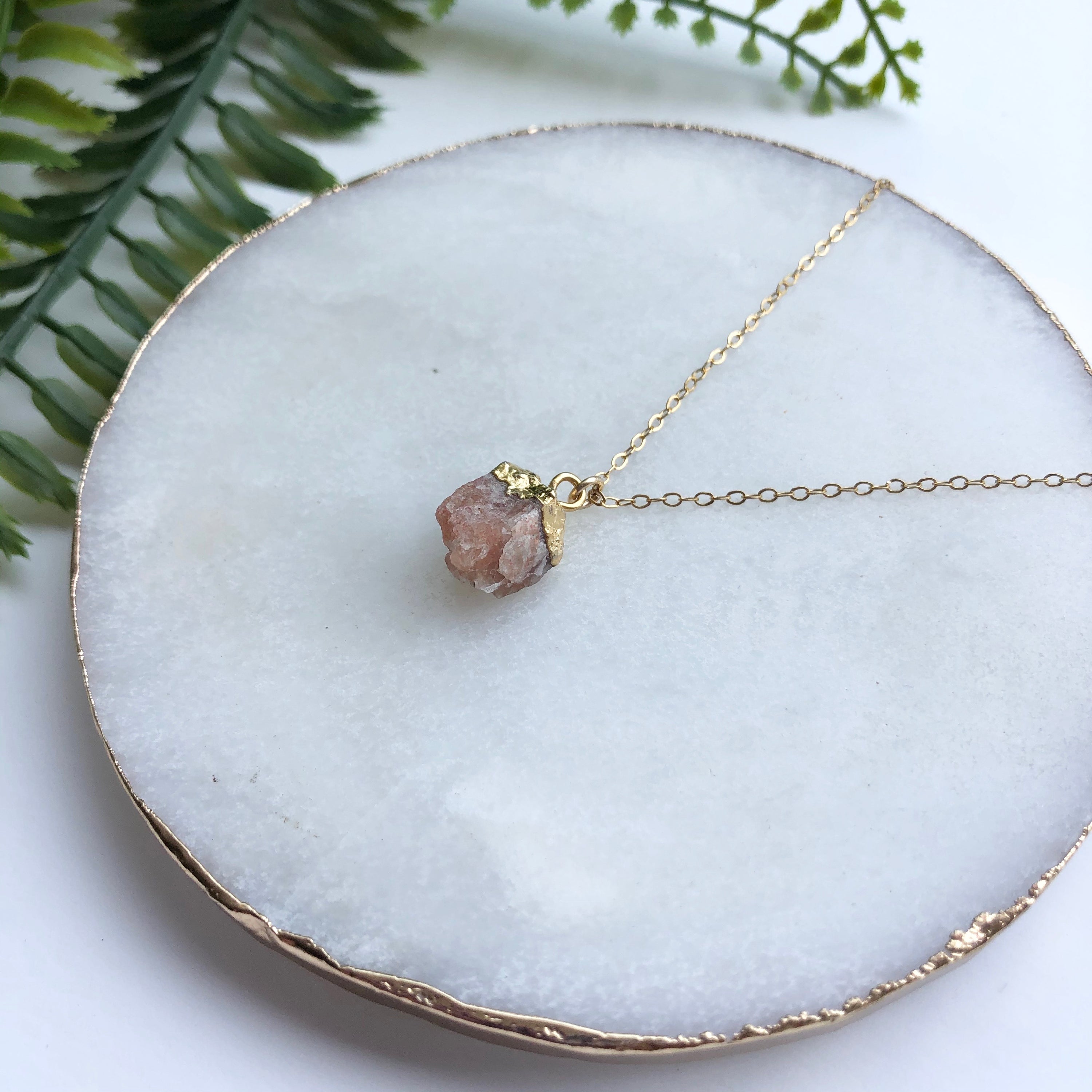 A beautiful 14K gold filled rough nugget necklace showcasing unique, natural nuggets on a delicate chain.