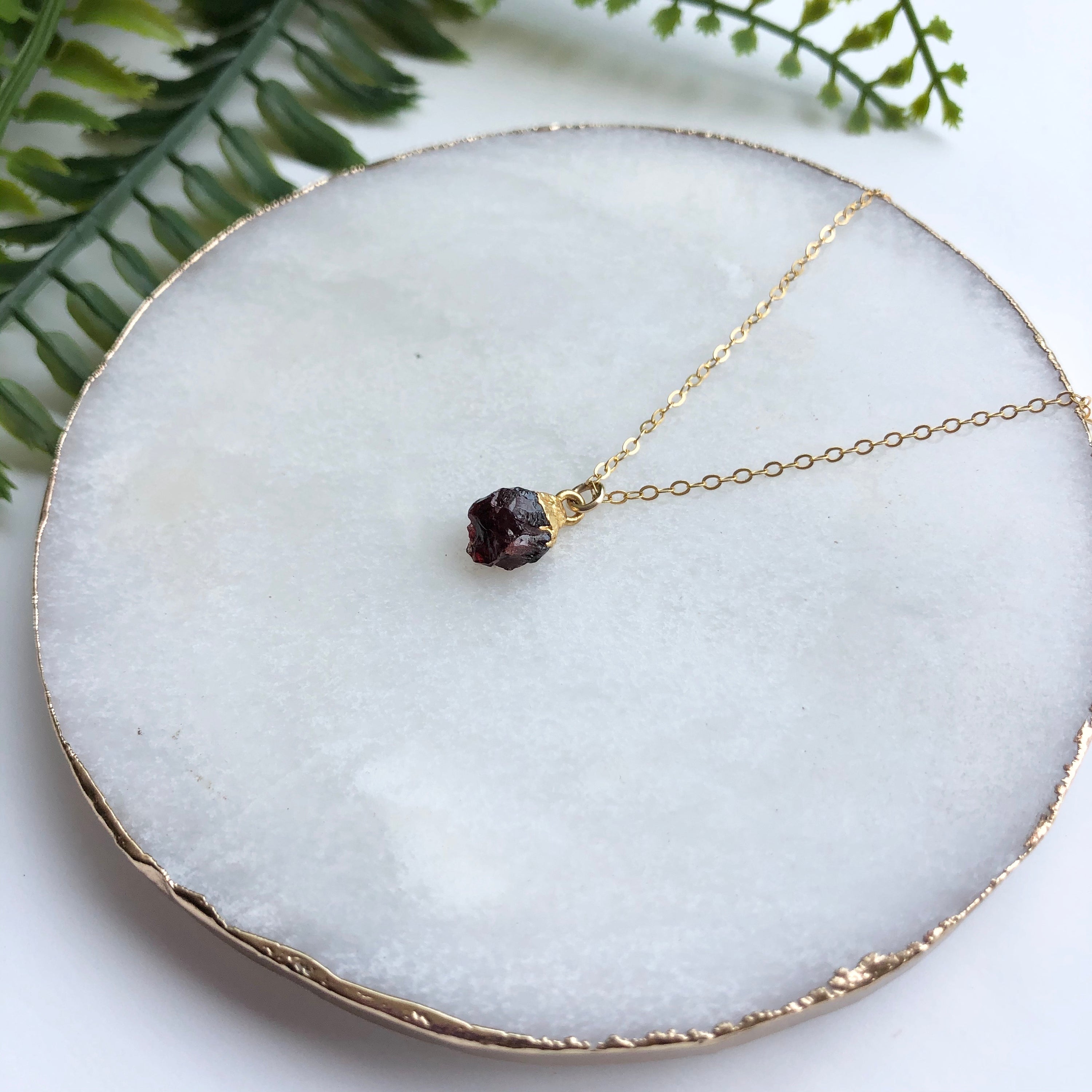 A beautiful 14K gold filled rough nugget necklace showcasing unique, natural nuggets on a delicate chain.