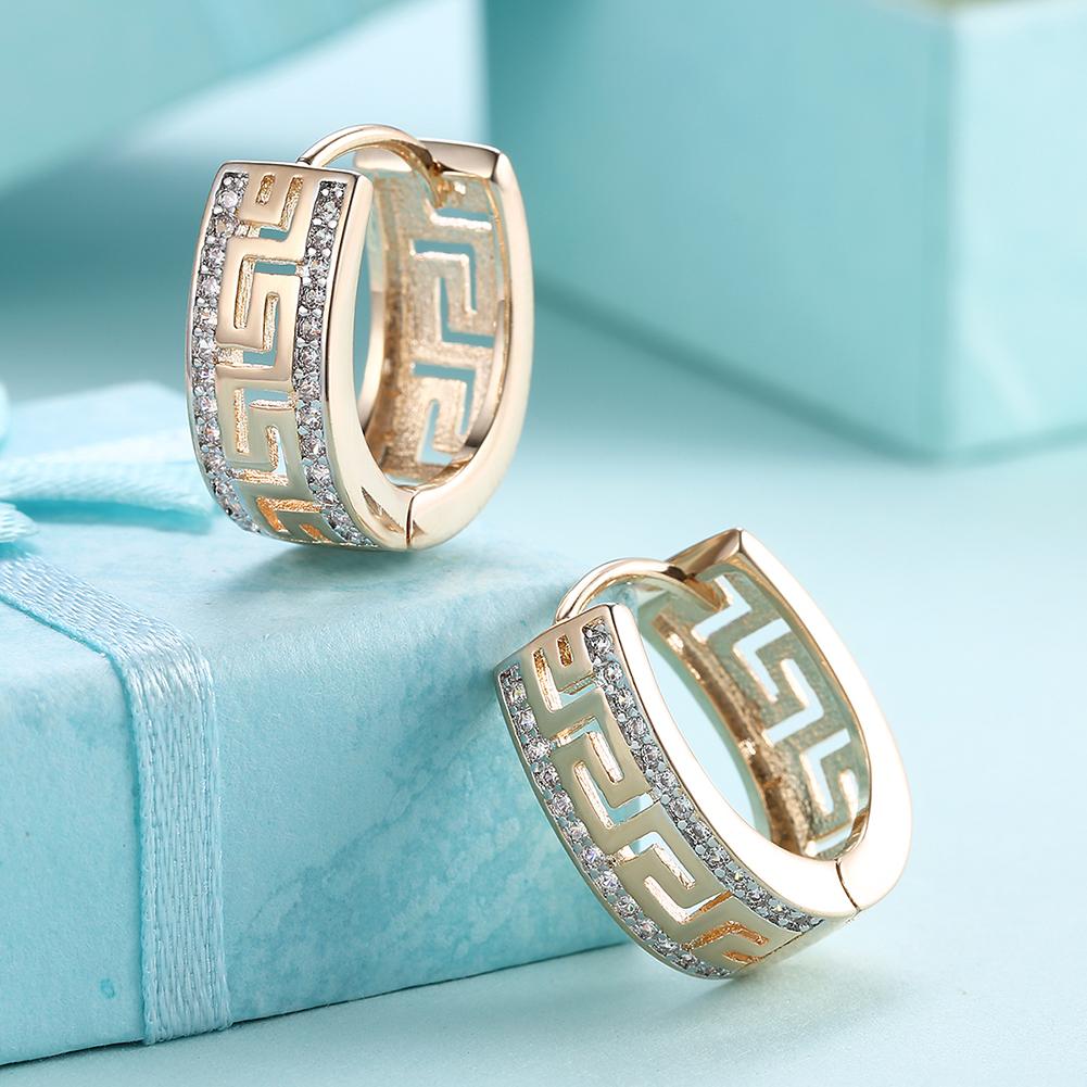 Elegant 14K Gold Plated Roman Ingrain Pave Huggie Earrings with white elements, showcasing a stylish design.