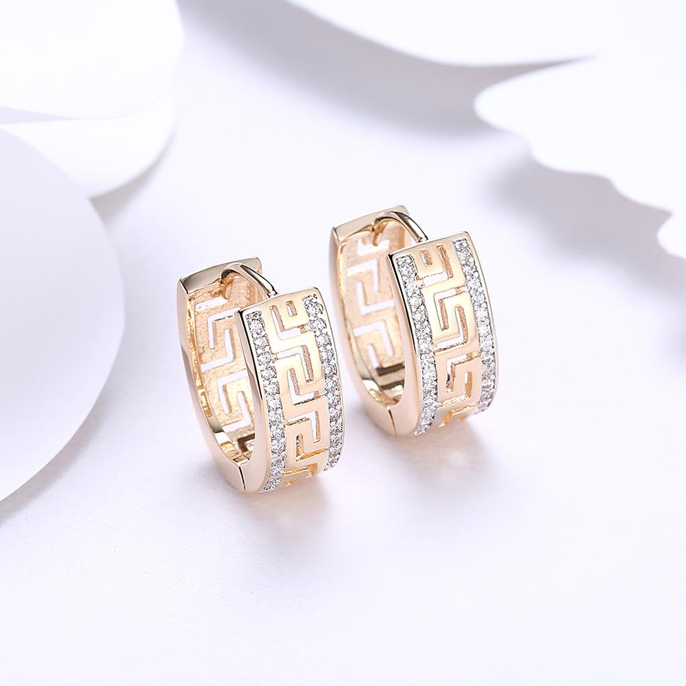 Elegant 14K Gold Plated Roman Ingrain Pave Huggie Earrings with white elements, showcasing a stylish design.