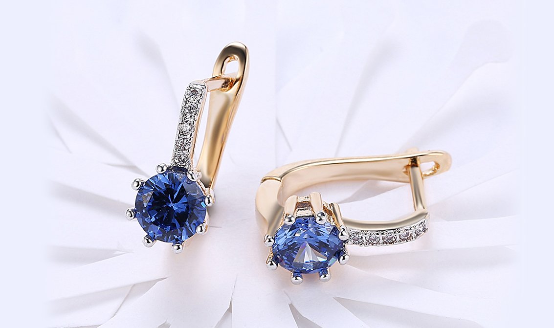 Elegant 14K Gold Plating Starburst Leverback Earrings featuring Austrian elements in white and blue options.