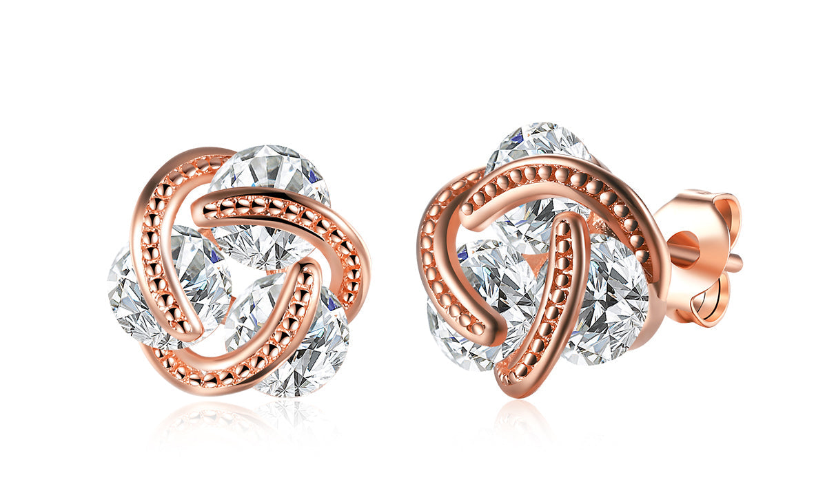 Elegant 14K Gold Plating Twisted 3-Stone Stud Earrings in gold, showcasing their intricate design and sparkling stones.