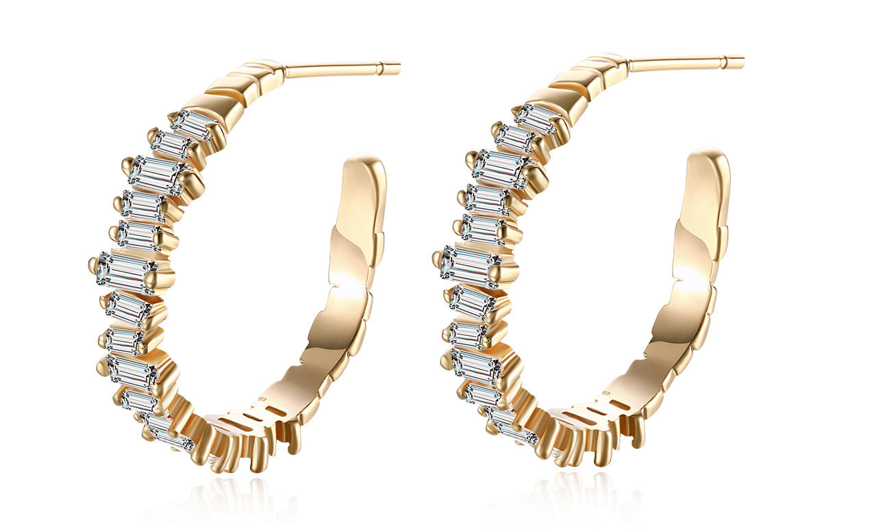 Elegant 14K gold plated earrings featuring emerald cut white sapphires, showcasing a unique asymmetrical design.