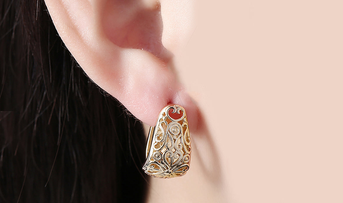 Elegant 14K gold plated filigree laser cut clip-on earrings, showcasing intricate design and craftsmanship.