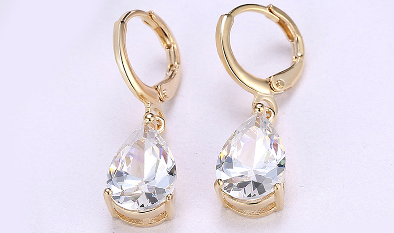 Elegant 14K Gold Plating Sleek Gemstone Pear Cut Drop Earrings in Sapphire, Amethyst, and White Sapphire options, showcasing their luxurious design.