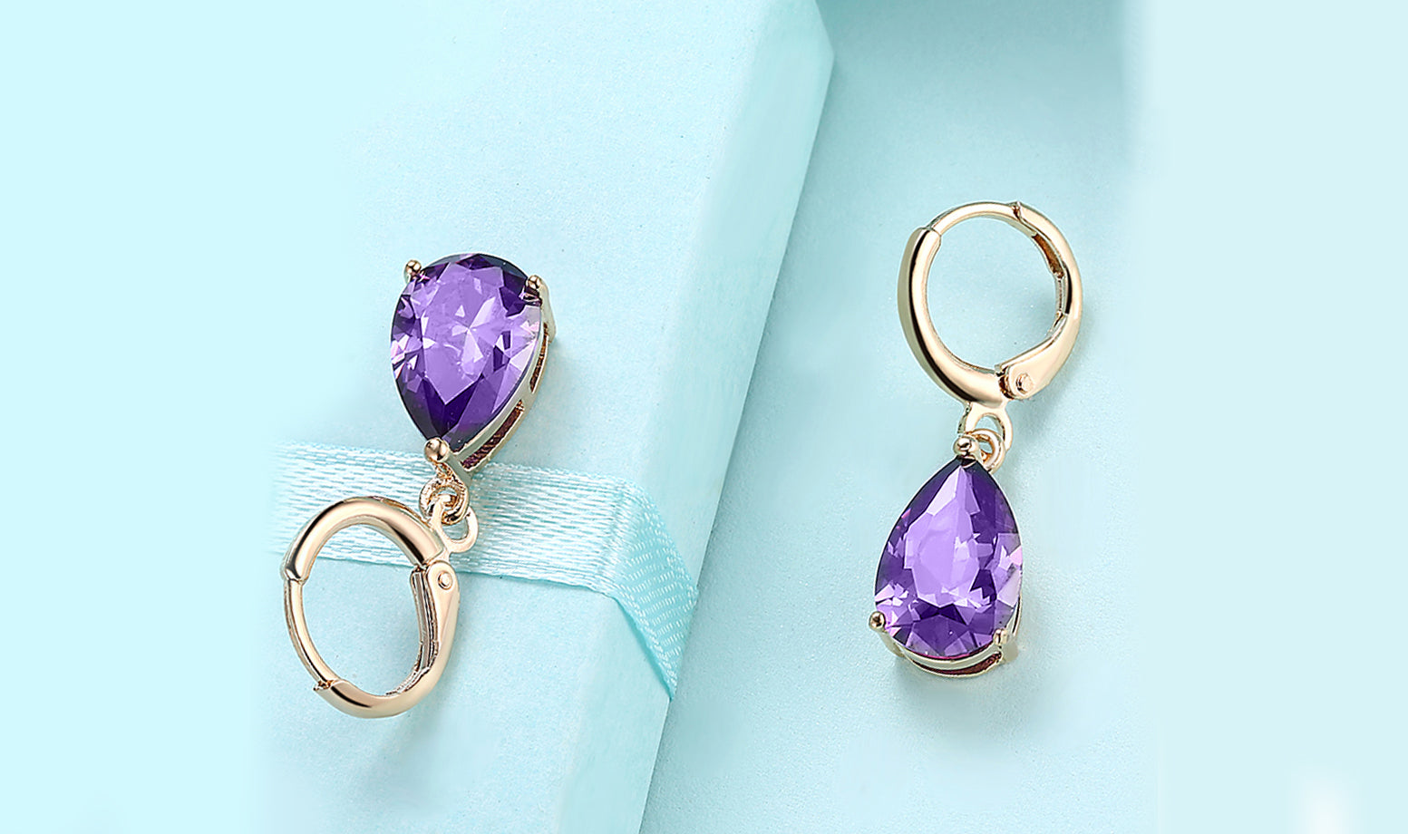 Elegant 14K Gold Plating Sleek Gemstone Pear Cut Drop Earrings in Sapphire, Amethyst, and White Sapphire options, showcasing their luxurious design.