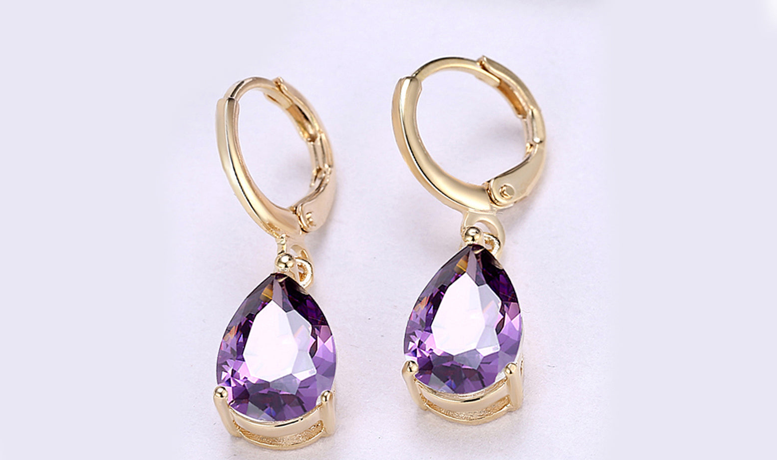 Elegant 14K Gold Plating Sleek Gemstone Pear Cut Drop Earrings in Sapphire, Amethyst, and White Sapphire options, showcasing their luxurious design.