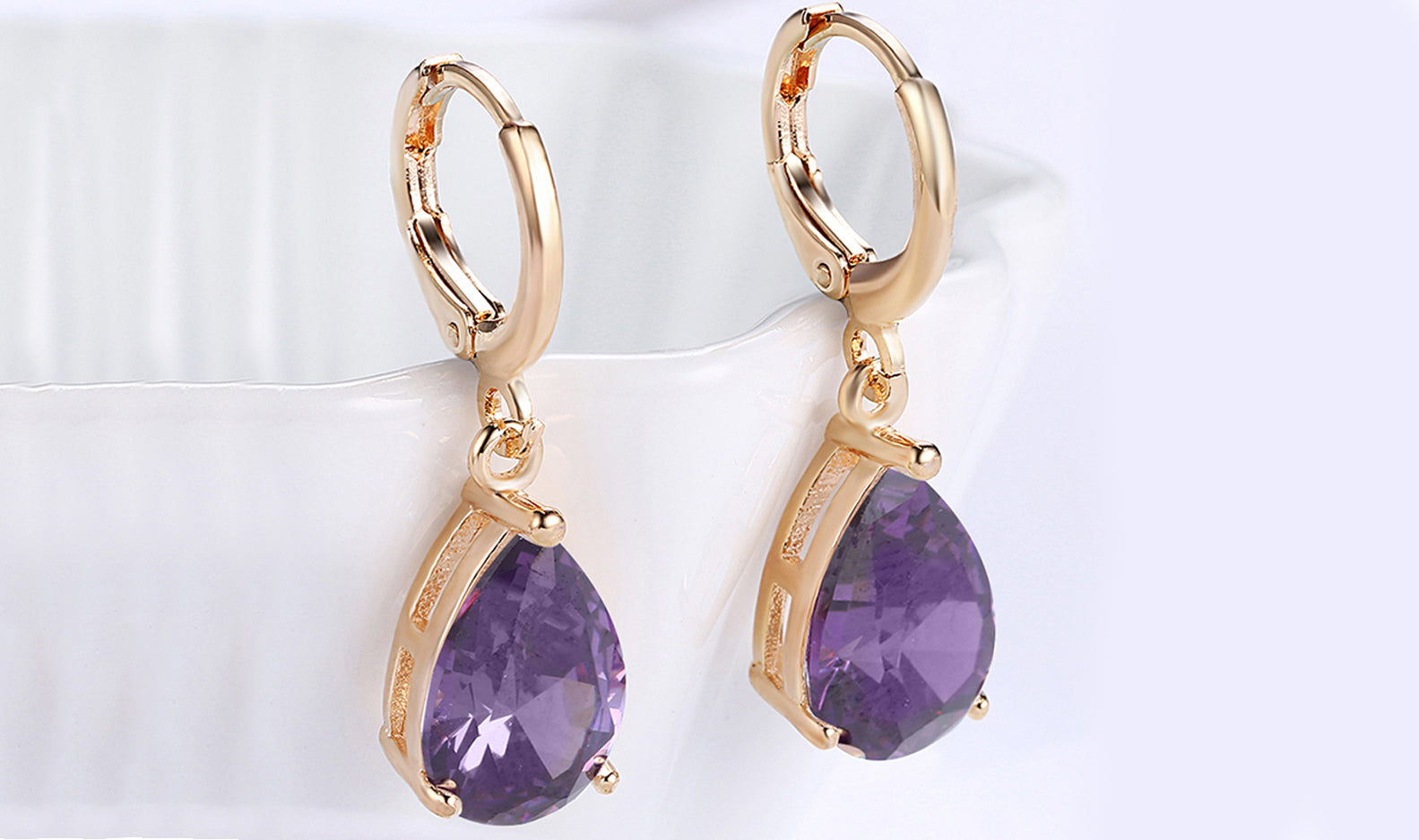 Elegant 14K Gold Plating Sleek Gemstone Pear Cut Drop Earrings in Sapphire, Amethyst, and White Sapphire options, showcasing their luxurious design.