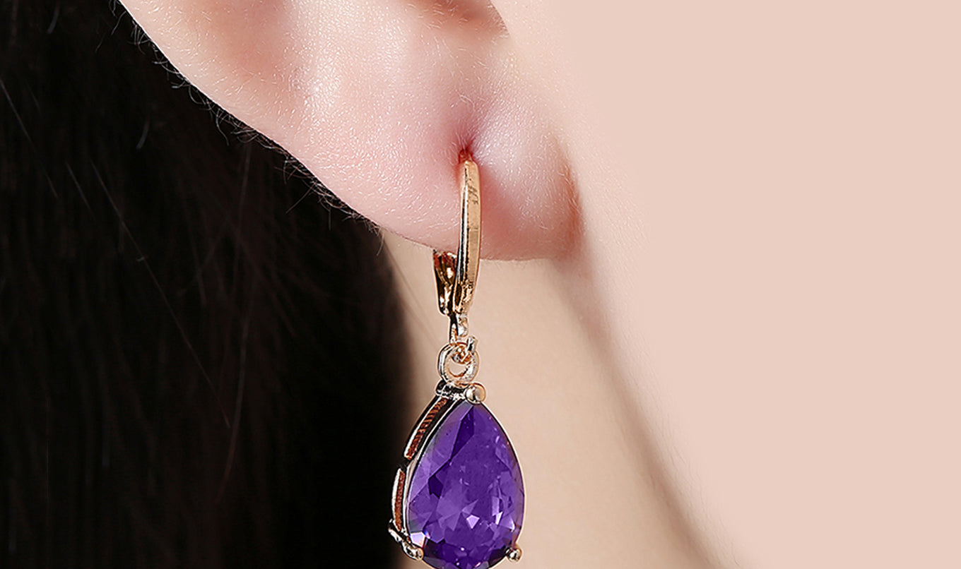 Elegant 14K Gold Plating Sleek Gemstone Pear Cut Drop Earrings in Sapphire, Amethyst, and White Sapphire options, showcasing their luxurious design.