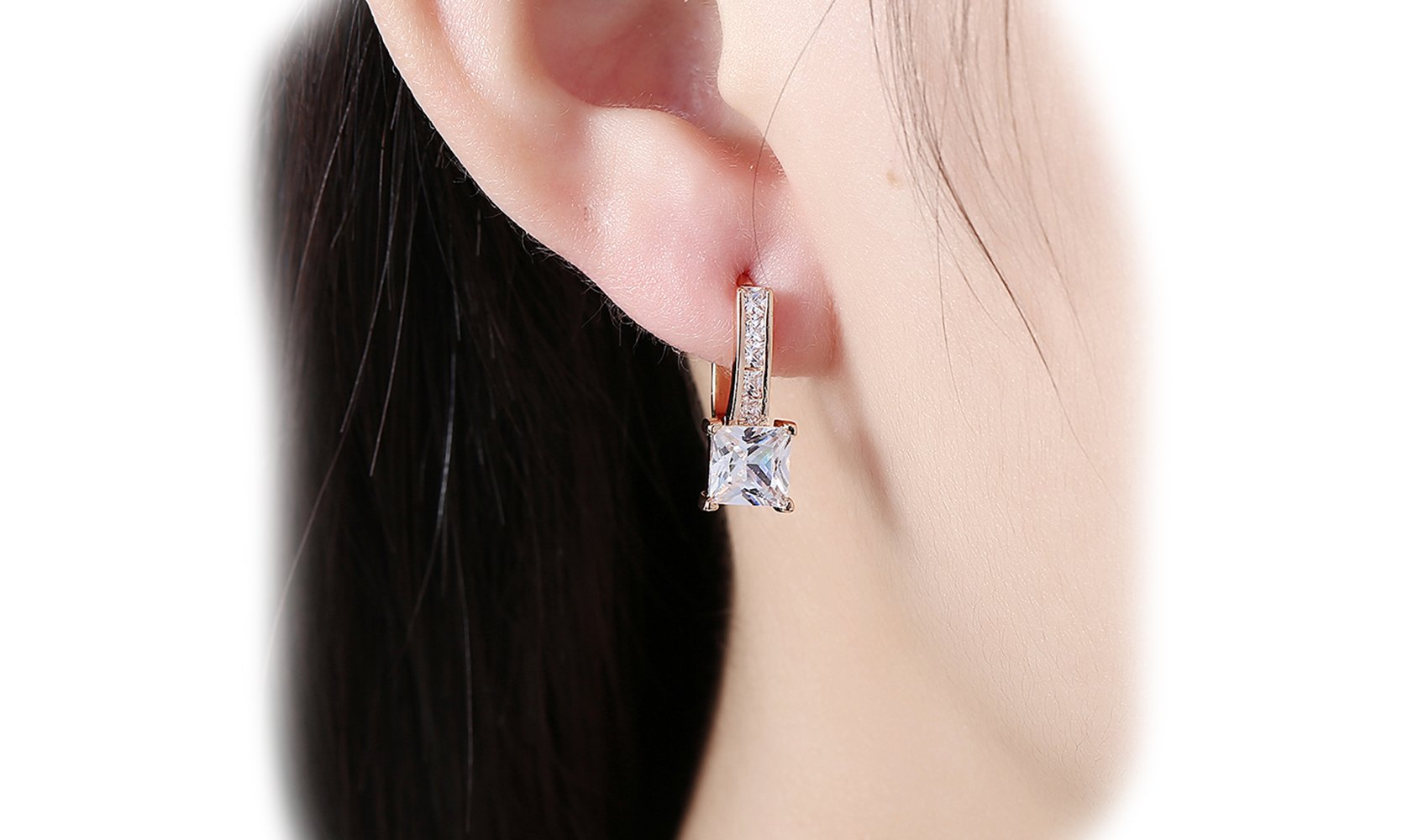 Elegant 14K gold plated lever back earrings featuring white Austrian elements, showcasing a sleek and classic design.