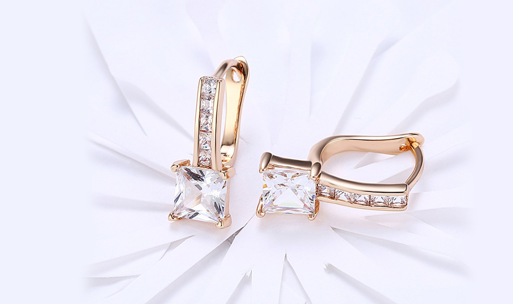 Elegant 14K gold plated lever back earrings featuring white Austrian elements, showcasing a sleek and classic design.