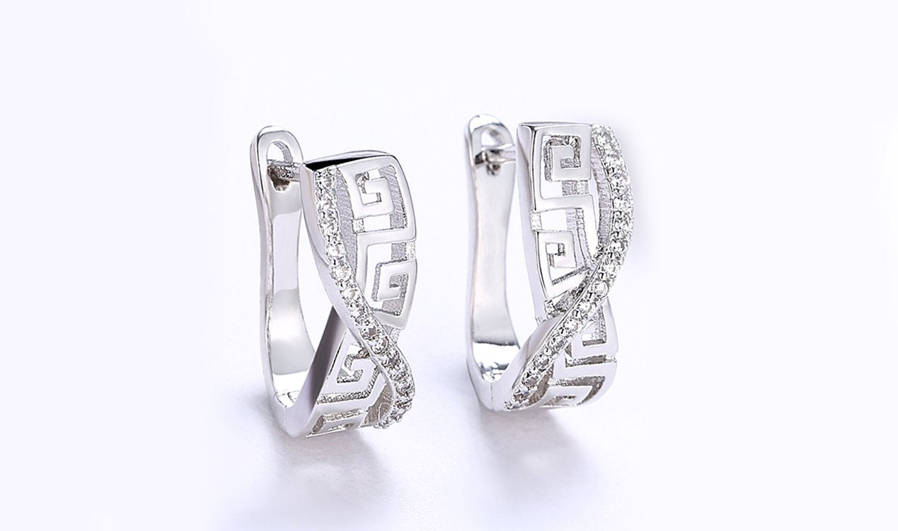 Elegant 14K white gold plated earrings featuring a Greek key design with sparkling Austrian elements.