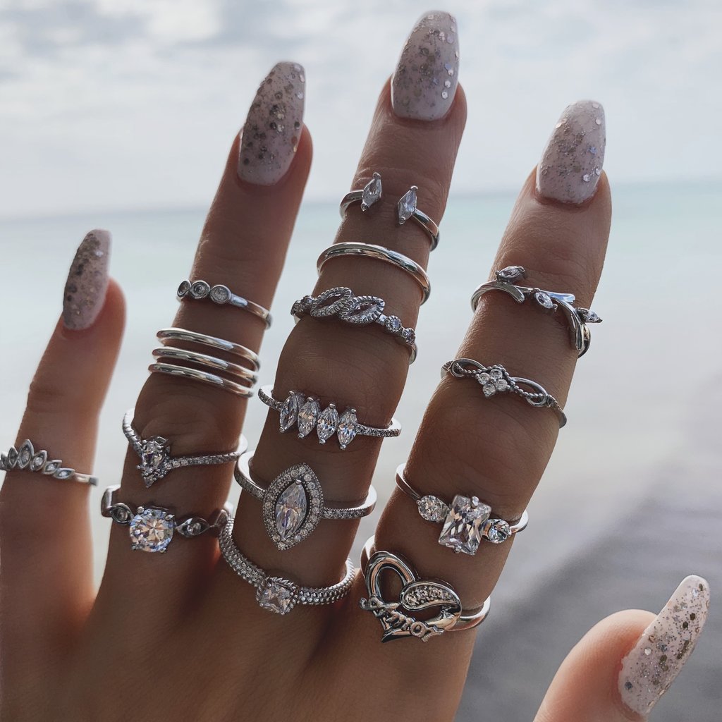 15 Piece Halo Pave Ring Set featuring sparkling crystals, elegantly designed in 18K white gold plating, showcasing a luxurious and sophisticated look.