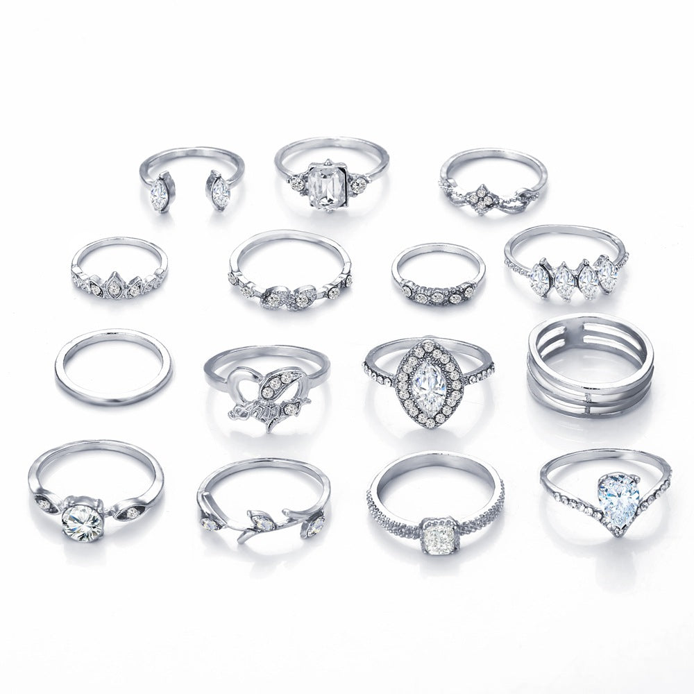 15 Piece Halo Pave Ring Set featuring sparkling crystals, elegantly designed in 18K white gold plating, showcasing a luxurious and sophisticated look.