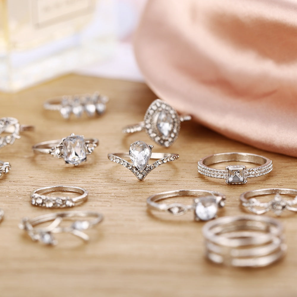 15 Piece Halo Pave Ring Set featuring sparkling crystals, elegantly designed in 18K white gold plating, showcasing a luxurious and sophisticated look.