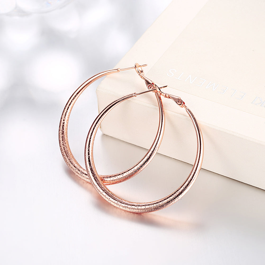 Elegant 1.6-inch round hoop earrings in 18K rose gold plating, showcasing a luxurious and timeless design.