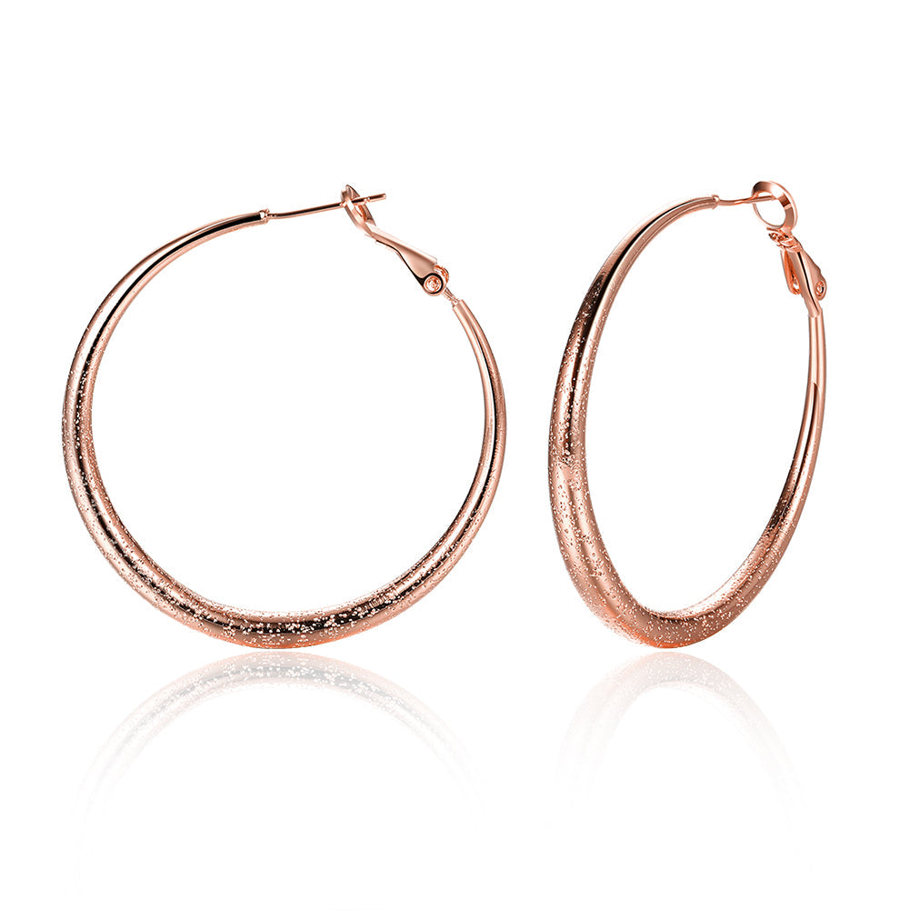 Elegant 1.6-inch round hoop earrings in 18K rose gold plating, showcasing a luxurious and timeless design.