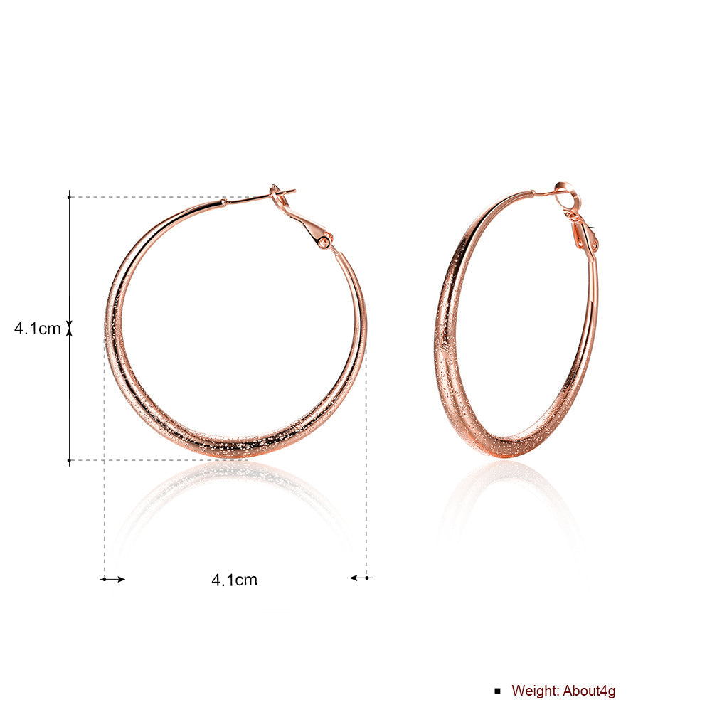 Elegant 1.6-inch round hoop earrings in 18K rose gold plating, showcasing a luxurious and timeless design.