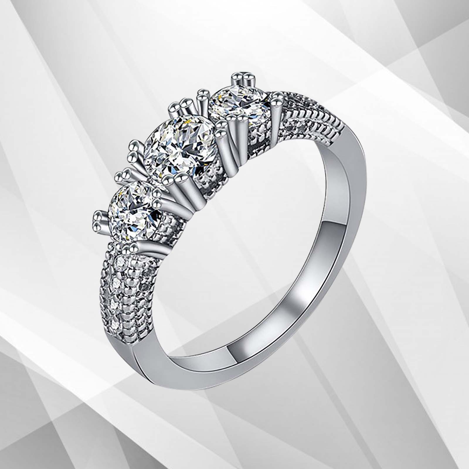 1.8Ct Round-Cut Diamonds Three Stones Bridal Engagement Ring in 18K White Gold, showcasing its elegant design and sparkling diamonds.