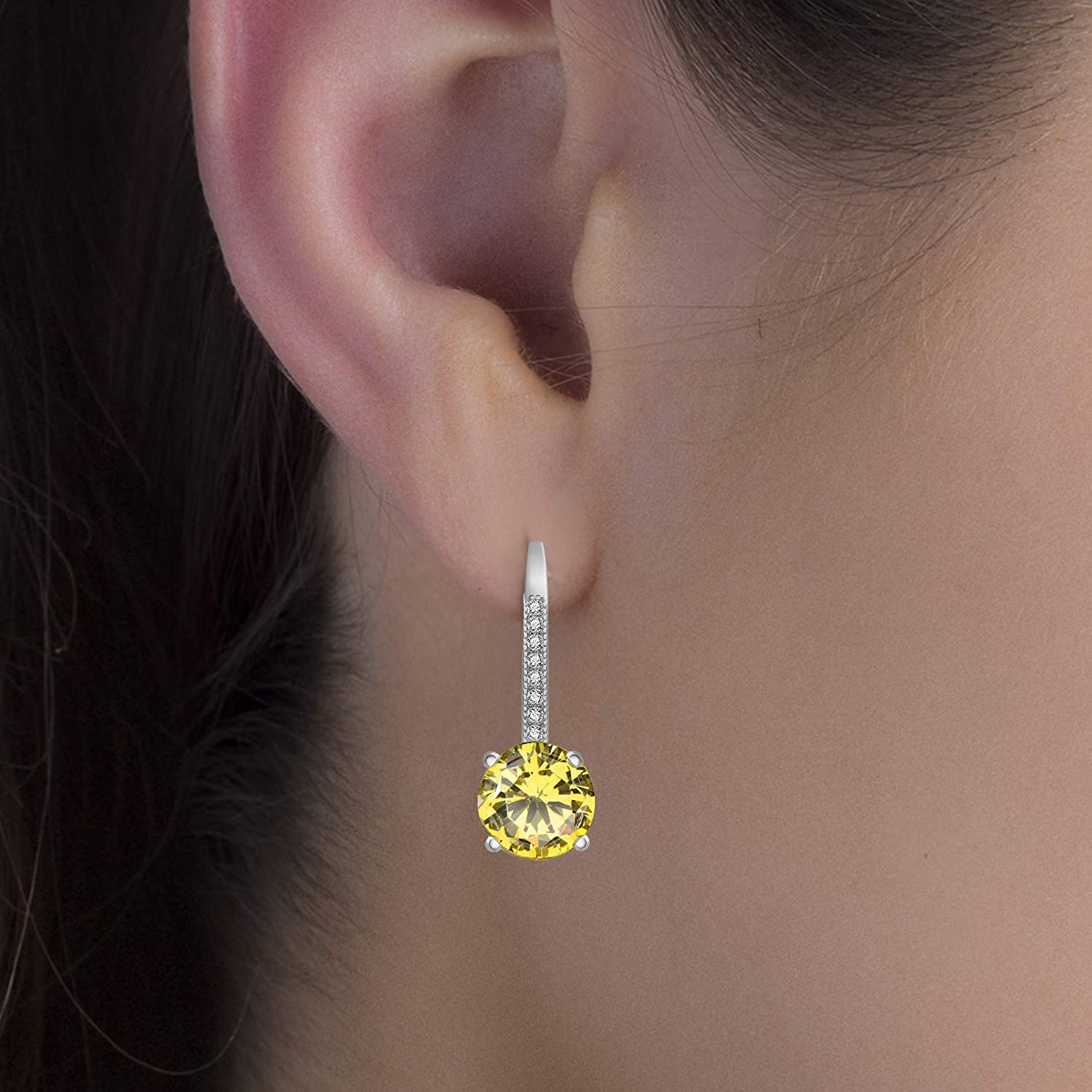 Elegant 18K Gold Plated drop earrings featuring 1.75 Cttw genuine white topaz in a classic 4 prong design with leverback closure.