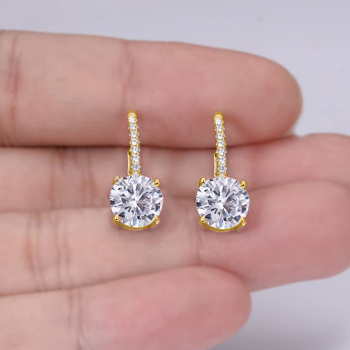 Elegant 18K Gold Plated drop earrings featuring 1.75 Cttw genuine white topaz in a classic 4 prong design with leverback closure.