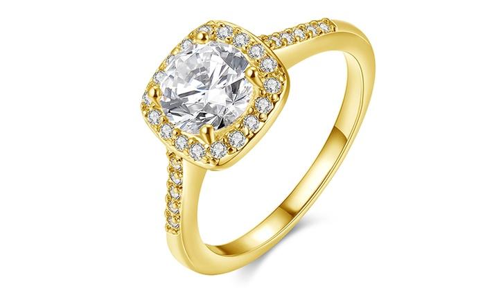 Elegant 18K Gold-Plated Halo Ring featuring Austrian Elements crystals, showcasing a stunning halo design with free matching studs.