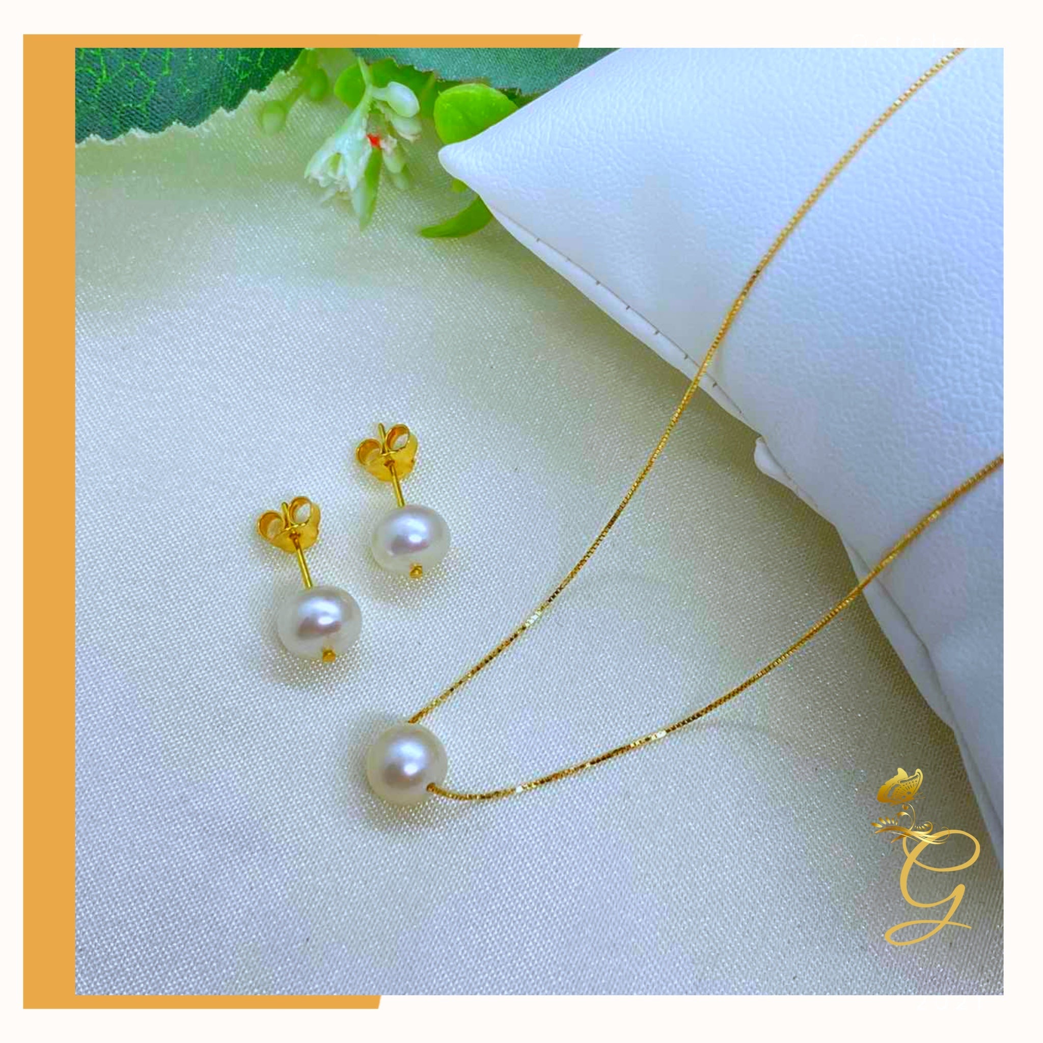 Elegant 18K real gold jewelry set featuring white pearl earrings and an 18-inch necklace, showcasing luxury and sophistication.