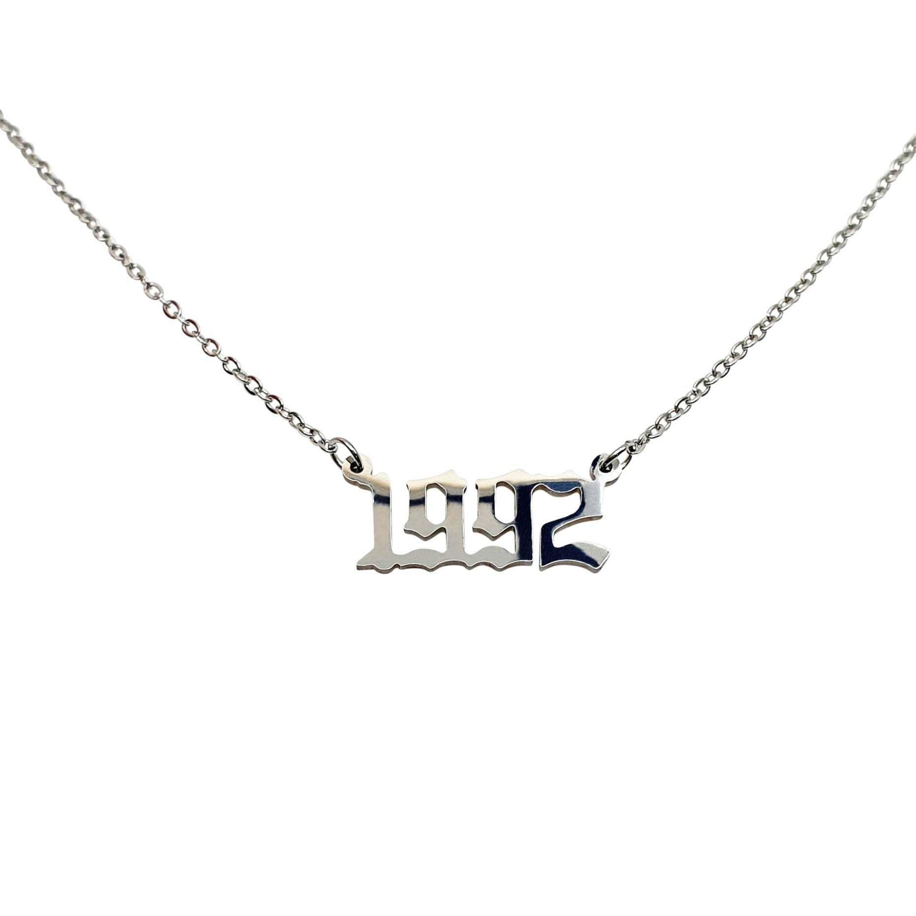 A stylish 1992 Year Necklace made of tarnish-free stainless steel, available in gold and silver, showcasing a bold 2cm pendant on an 18-inch chain.