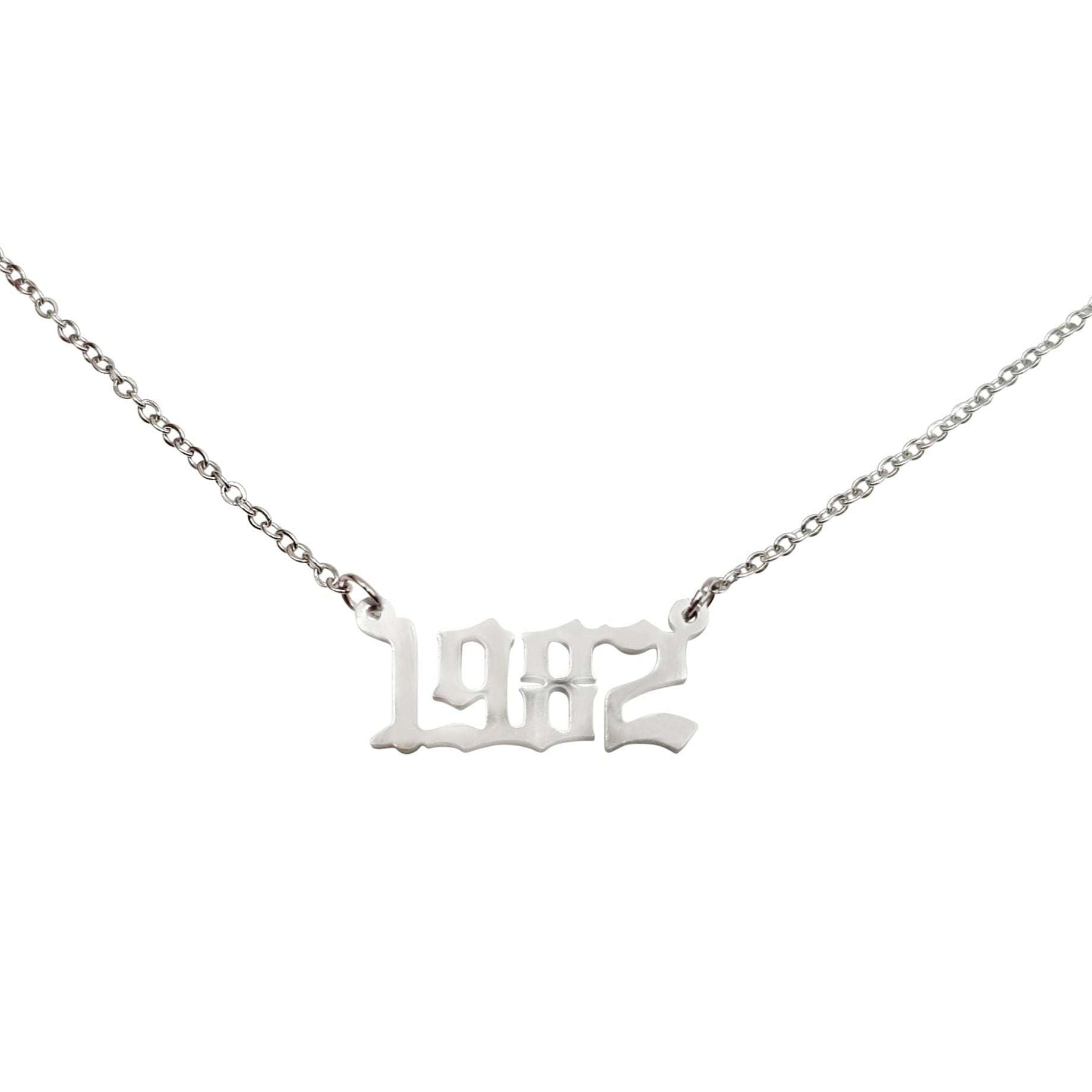 A stylish 1982 Year Necklace made of tarnish-free stainless steel, available in gold and silver finishes, featuring a 2cm pendant on an 18-inch chain.