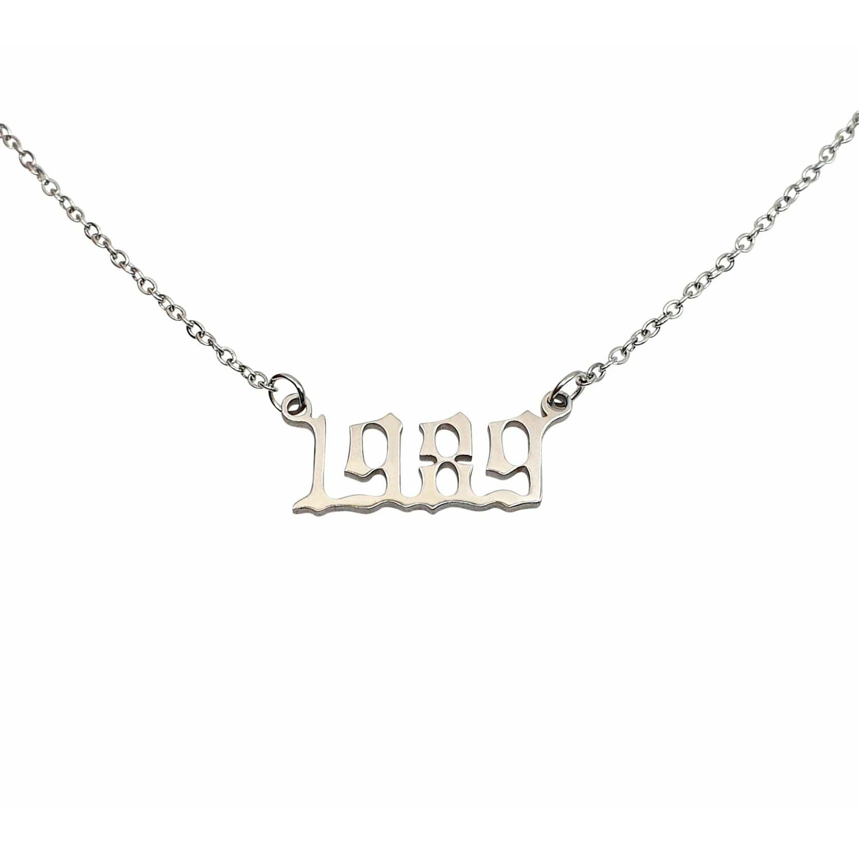 A stylish 1989 Year Necklace made of tarnish-free stainless steel, available in gold and silver finishes, featuring a 2cm pendant on an 18-inch chain.