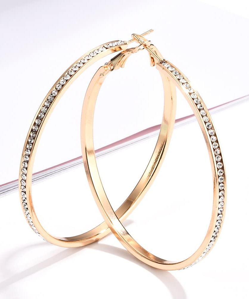 Elegant 2-inch pave hoop earrings adorned with sparkling crystals, featuring a luxurious 18K gold plating, designed in Italy.