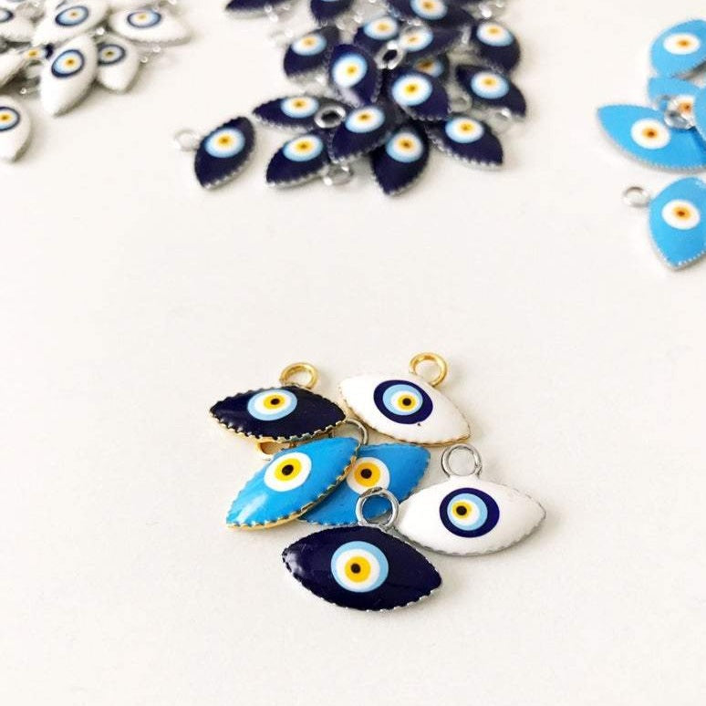 A bulk set of 20 blue evil eye beads, featuring intricate designs and a shiny finish, ideal for jewelry making and DIY projects.