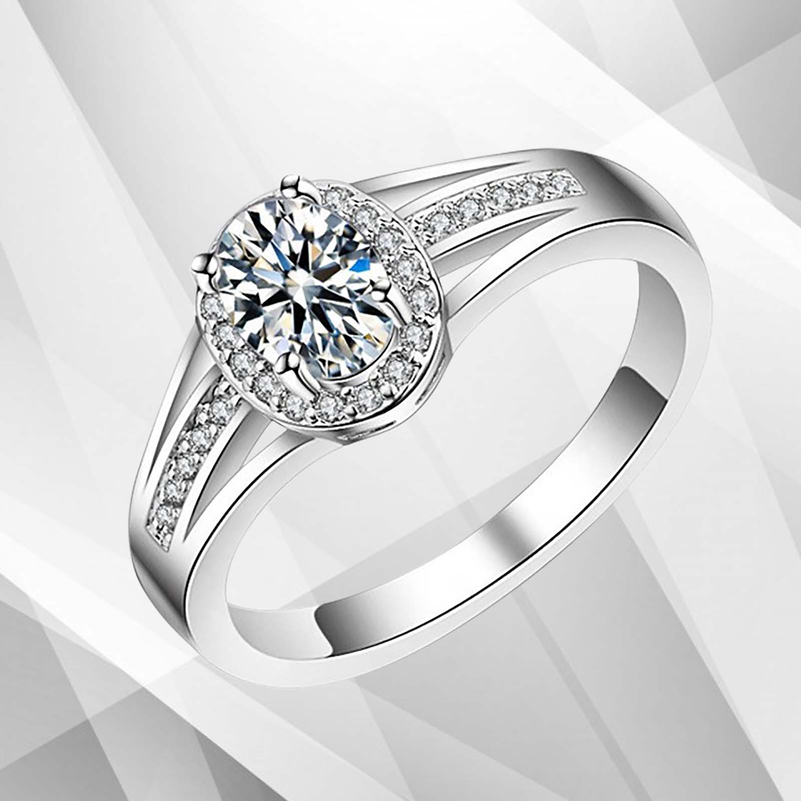 2.5Ct oval-cut diamond cushion halo engagement ring in 18K white gold, featuring a central diamond surrounded by smaller stones in a pave setting.