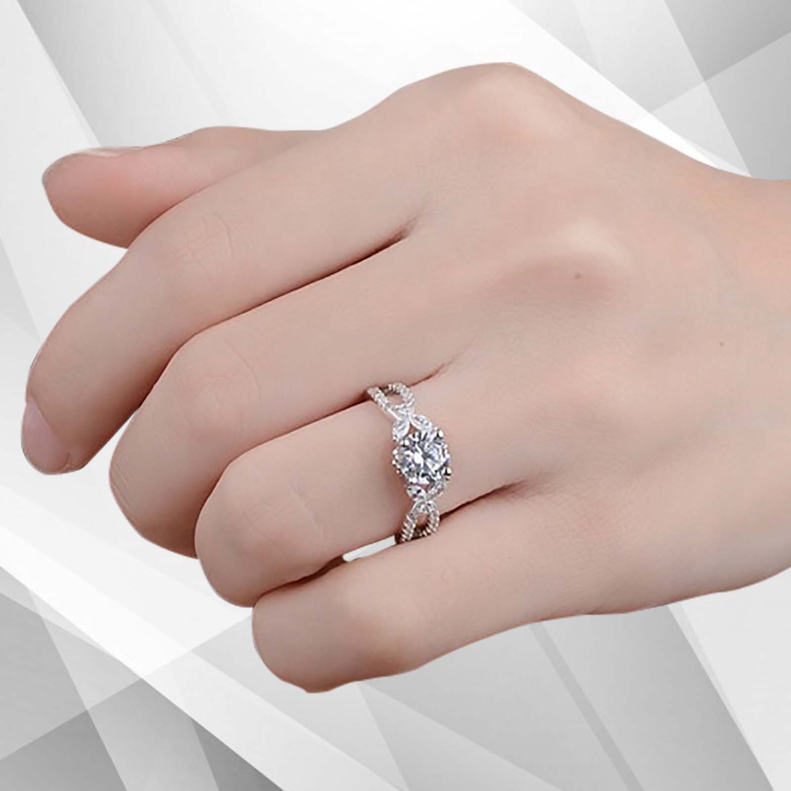 2.5Ct Round-Cut CZ Diamond Solitaire Bridal Engagement Ring set in 18K white gold, showcasing a brilliant diamond in a secure prong setting.