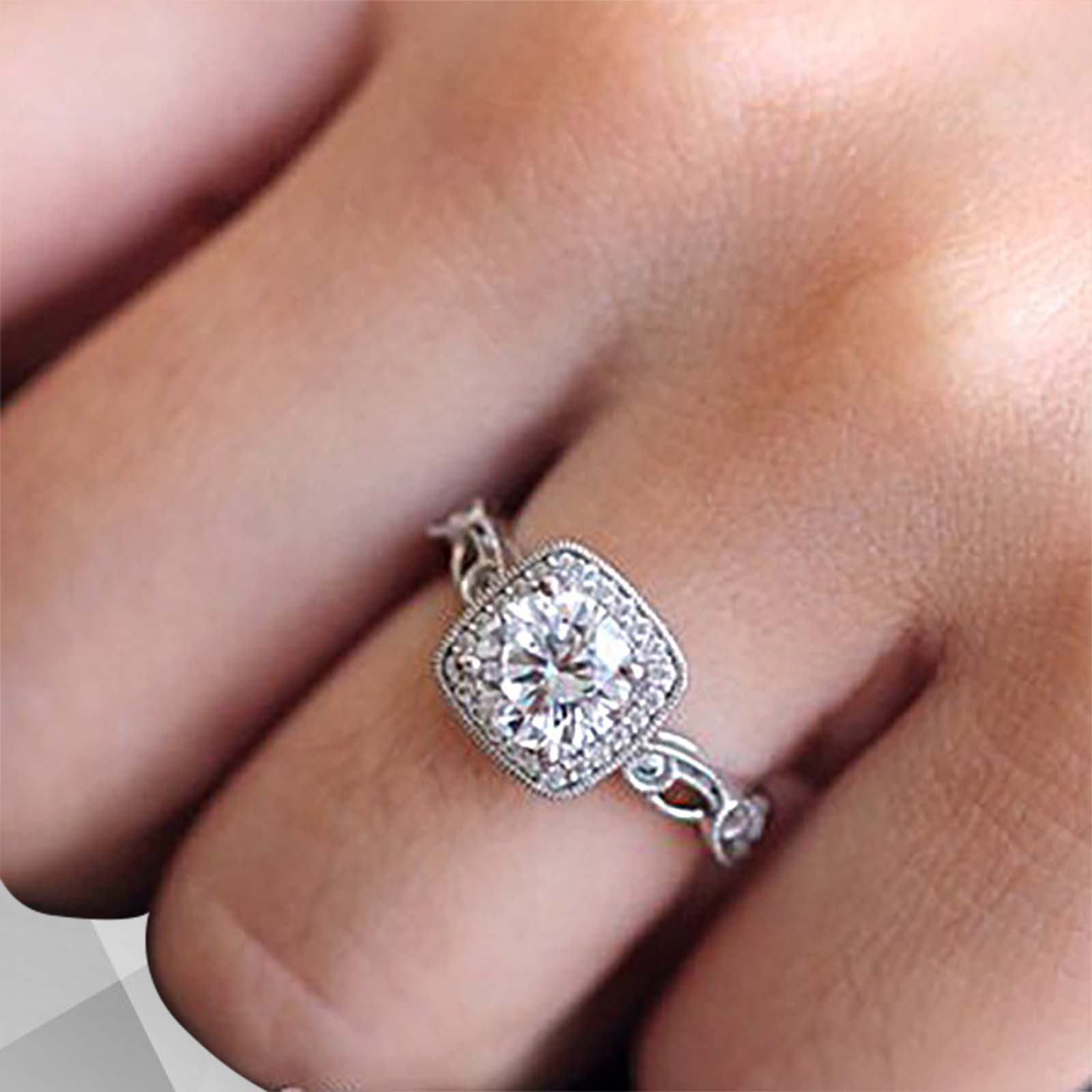 2.88Ct Large CZ Diamond Cushion Halo Engagement Ring set in 18Ct white gold, featuring a sparkling cushion halo design with round cut stones.