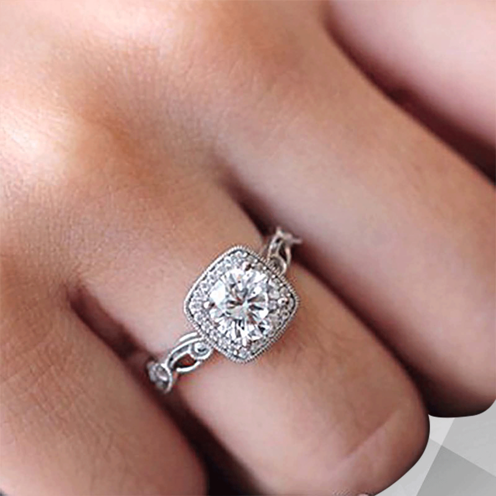 2.88Ct Large CZ Diamond Cushion Halo Engagement Ring set in 18Ct white gold, featuring a sparkling cushion halo design with round cut stones.