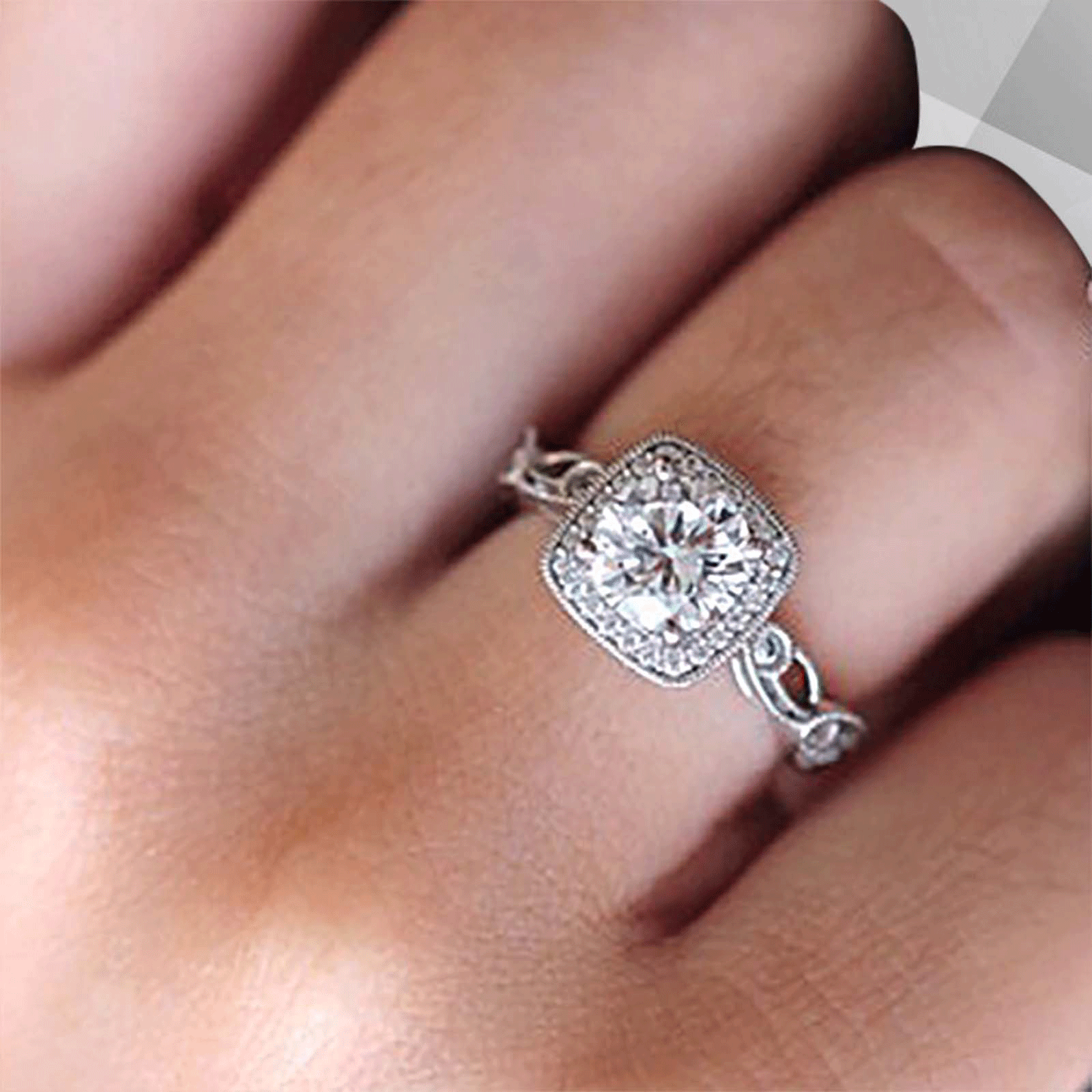 2.88Ct Large CZ Diamond Cushion Halo Engagement Ring set in 18Ct white gold, featuring a sparkling cushion halo design with round cut stones.