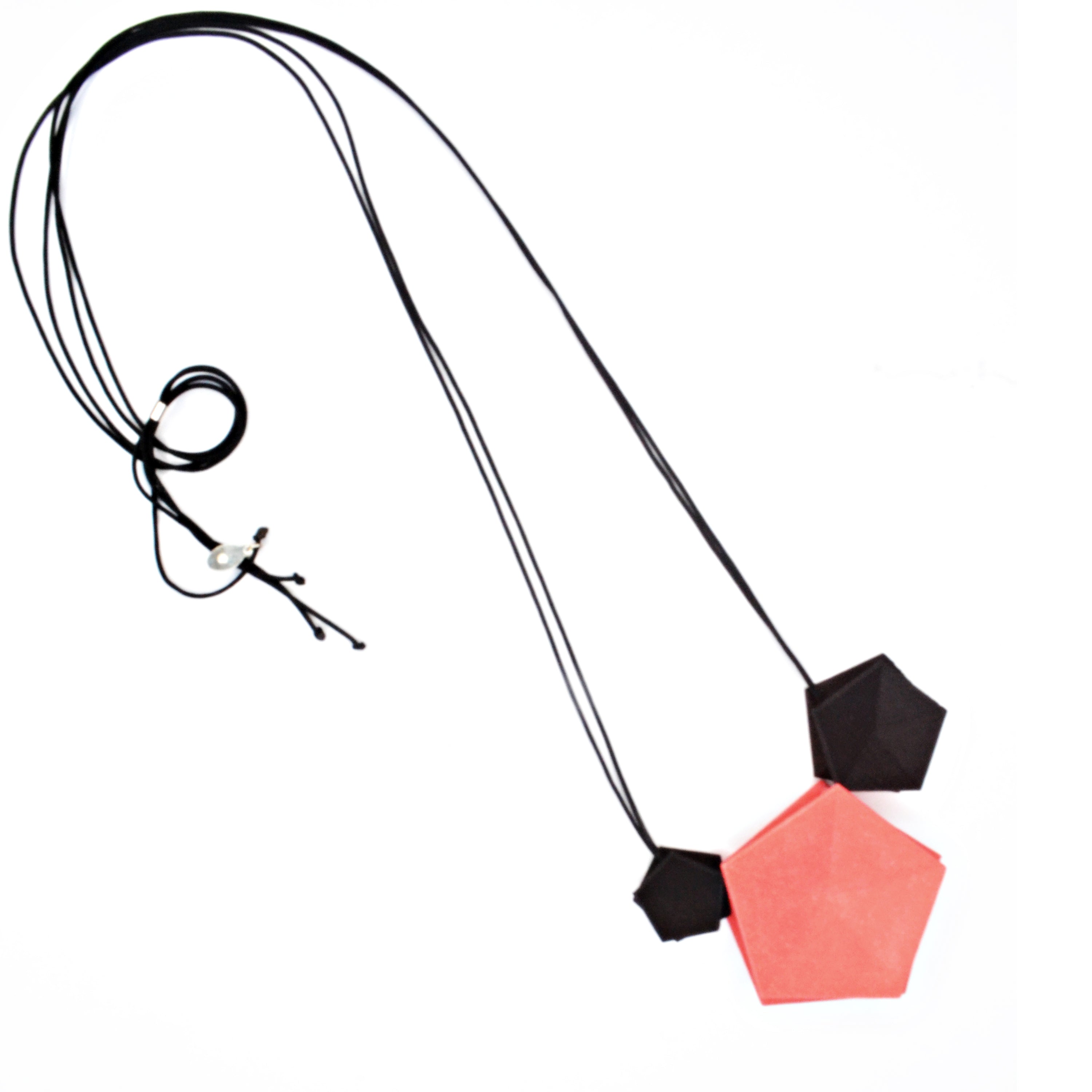 Vertigo 3 Element Necklace featuring three geometric pentagons on a black nylon cord, showcasing vibrant colors and a sterling silver bead for length adjustment.