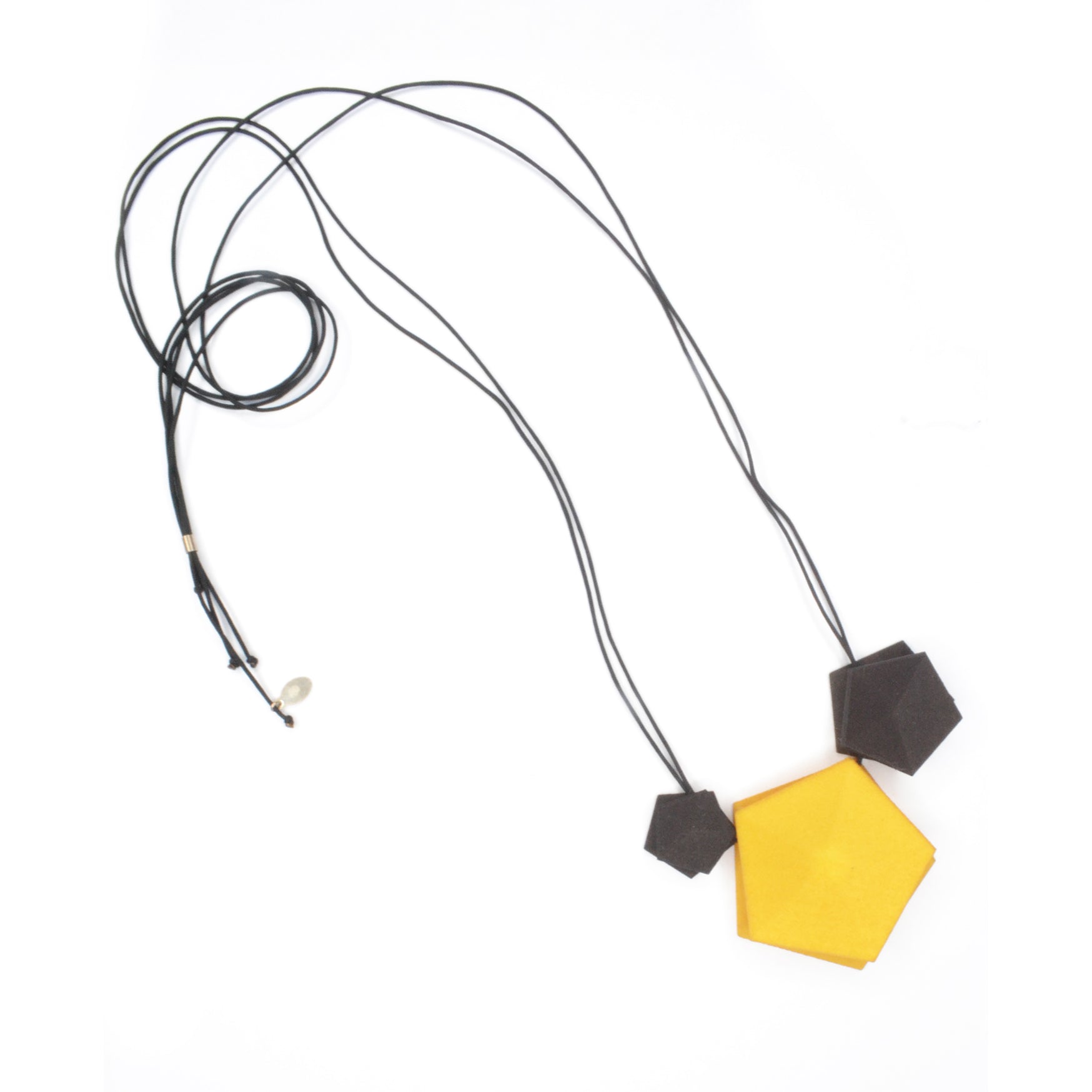 Vertigo 3 Element Necklace featuring three geometric pentagons on a black nylon cord, showcasing vibrant colors and a sterling silver bead for length adjustment.